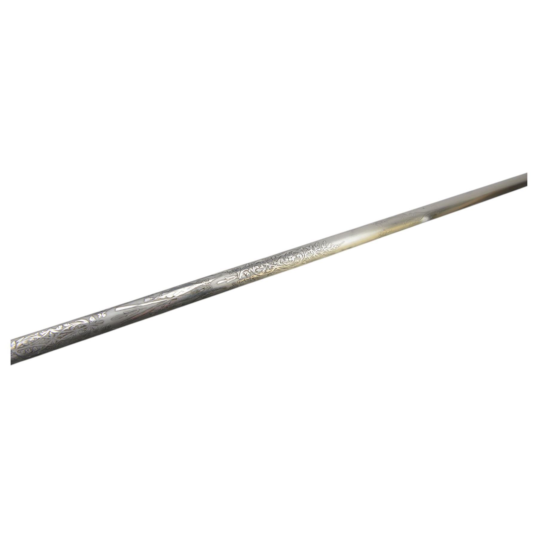 Victorian court and diplomatic ceremonial sword, the 79cm blade finely etched with scrolling motifs and engraved Huntsman Marlboro St, London, with crown pommel, wire bound grip, bow shaped guard and crossguard with gilt shell guard and crowned VR cypher,  in a brass mounted leather scabbard, overall L91cm
