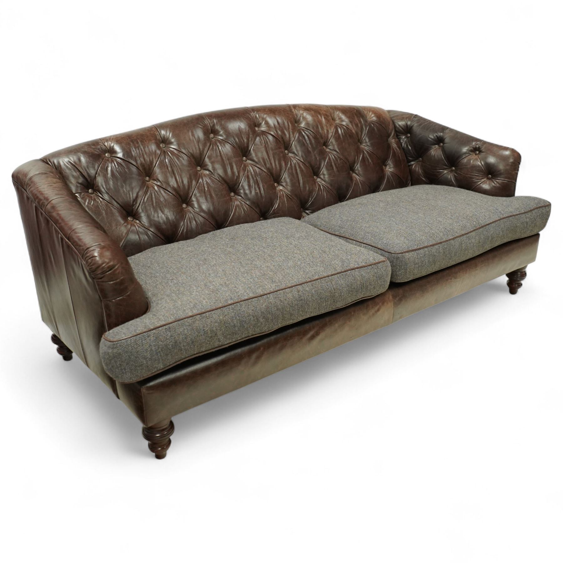 Tetrad - Harris Tweed and leather upholstered Chesterfield sofa, curved back and arms  with deep buttoned brown leather upholstery above loose herringbone tweed seat cushions with brown leather piping, raised on turned wooden feet 