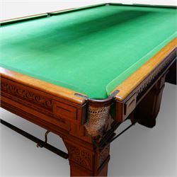 An outstanding bespoke late Victorian Aesthetic Movement golden oak full-sized snooker table of gothic influence, the rectangular slate bed covered in green baize within moulded rails and rounded pocket mounts, the protruding frame decorated with blind-fretwork frieze panels of Vitruvian scrolls and geometric ornament, over rails of repeating roundel carvings, raised on square chamfered and reeded supports with carved detail and panelled reserves, with further stylised brackets, stamped to the underside on all four edges R Anderson, serial number 4337
Viewing in situ near Tadcaster, please contact Chloe to arrange - 01904 393300