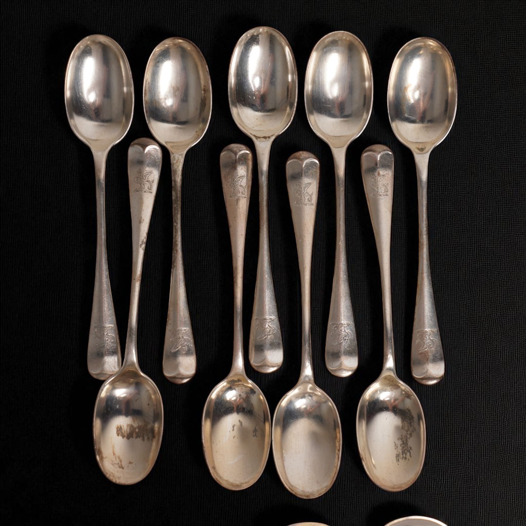 Suite of Edwardian silver rat tail cutlery engraved with a crest comprising twelve table forks, eleven dessert forks, twelve table spoons, eleven dessert spoons, nine teaspoons, soup ladle, pair of sauce ladles and basting spoon Sheffield 1901/02 Maker John Round & Son Ltd