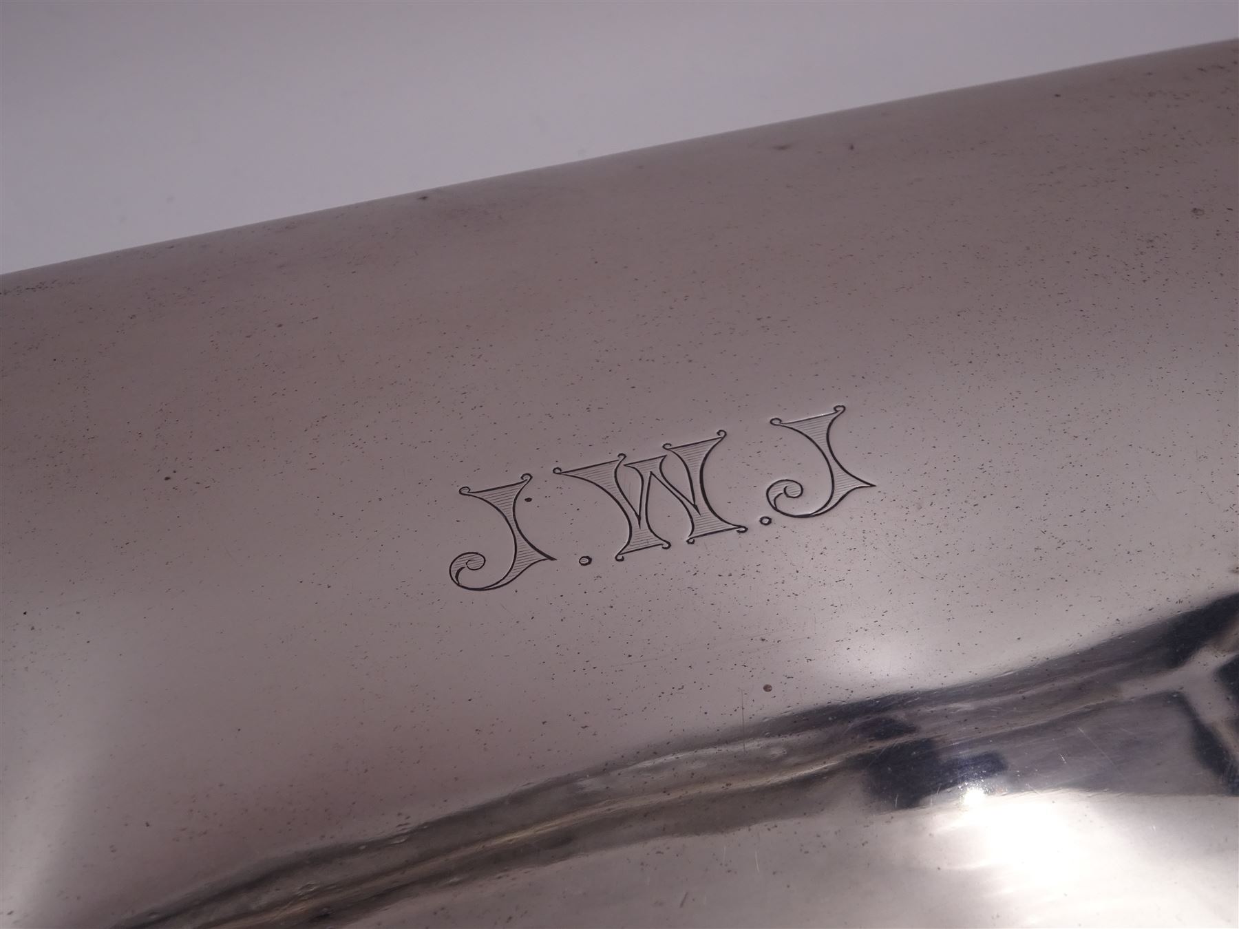 1920s silver mounted presentation cigarette box, of rectangular form, with engraved initials J.W.J and dated 1902-1927 to slightly domed hinged cover, opening to reveal compartmentalised softwood interior, upon four bracket feet, hallmarked Birmingham 1920, maker's mark worn and indistinct, H9cm, W23cm, reputedly given to John William Johnson, father of Amy Johnson,  famous for being the first long distance (to Australia) solo female pilot, and first female British grounds engineer, for his silver wedding anniversary