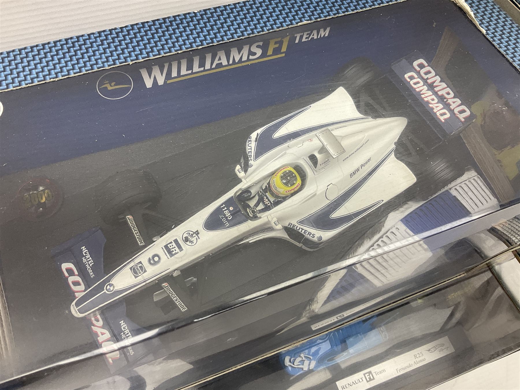 Five Mattel Hot Wheels 1:18 scale die-cast racing cars - Ferrari 248F1 Michael Schumacher, Renault F1 Team R25 Fernando Alonso, Williams F1 Team Williams FW28 Mark Webber, Jordan 199 Damon Hill and Williams F1 Team BMW; all boxed (5)