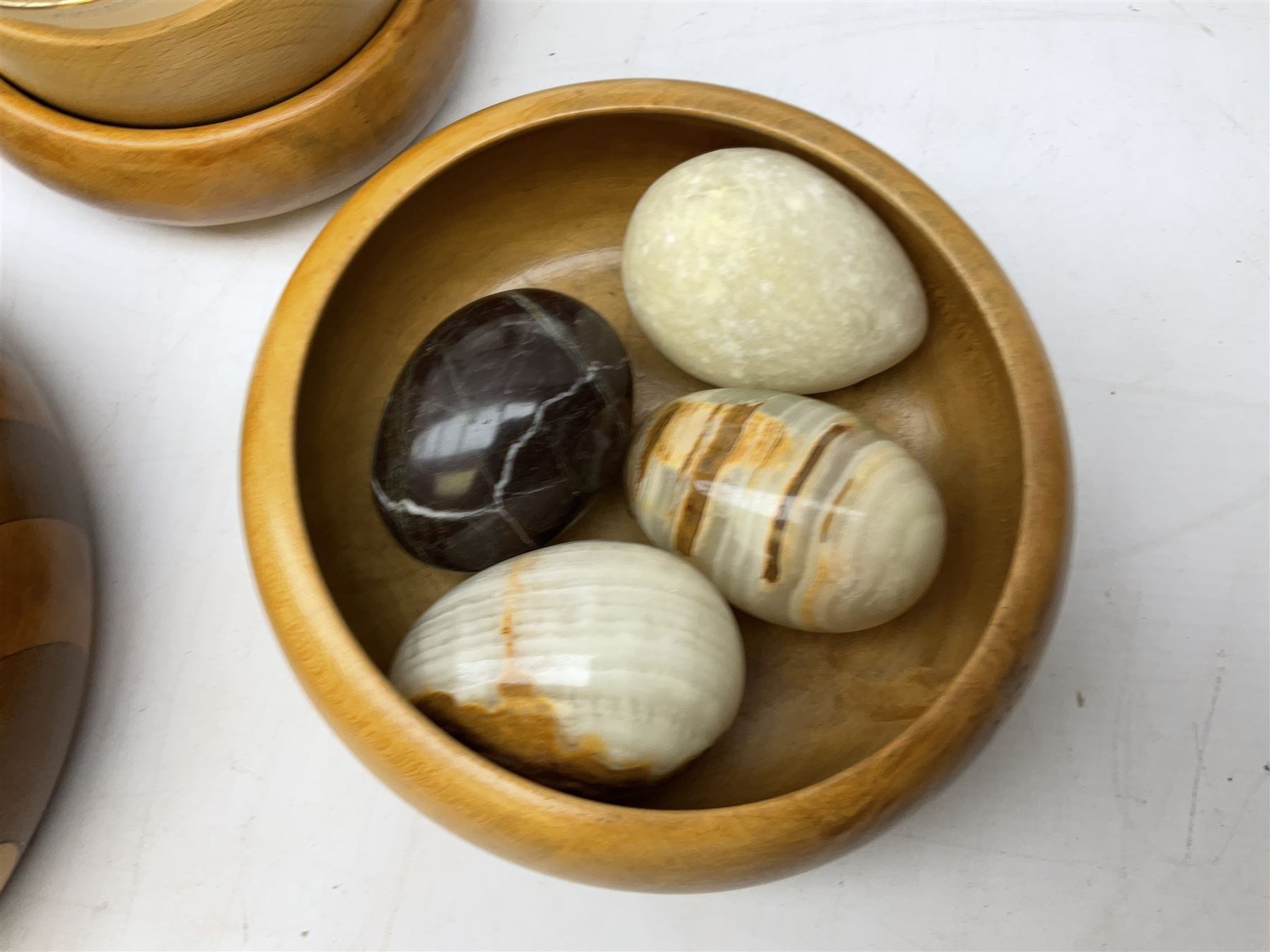 Quantity of cigarette cards to include three frames, and quantity of marble and agate eggs, turned wood bowls etc