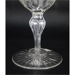 Large 19th century glass goblet, the bowl engraved with panels of flowers, upon a faceted baluster stem and circular foot with star cut base, H20.5cm, together with two smaller 19th century examples, the bowls engraved with initials 'M.A.F.' and 'M.A.F. J.F.', within foliate surrounds, tallest H16cm