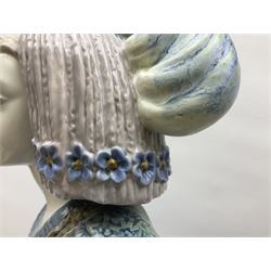 Large Lladro figure, La Menina, modelled as a maid of honor in service, on a mahogany oval base, limited edition 99/1000, sculpted by Jose Puche, with certificate of authenticity, framed and glazed, no 1812, year issued 1996, year retired 2019, H60cm