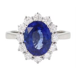 18ct white gold oval cut sapphire and round brilliant cut diamond cluster ring, hallmarked, sapphire approx 3.85 carat