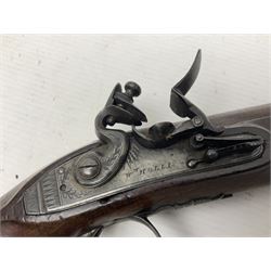 Early 19th century Wm. Hollis flintlock belt or pocket pistol, approximately 20 bore, the 10cm barrel with ram rod under, engraved lock plate with maker's name and roller frizzen, engraved trigger guard with pineapple finial and walnut stock with chequered grip L25cm overall