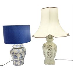 Modern pierced oriental white ceramic vase shaped table lamp, together with a blue and white baluster shaped example decorated with figures upon elephants, both with shades, tallest H83cm incl shade