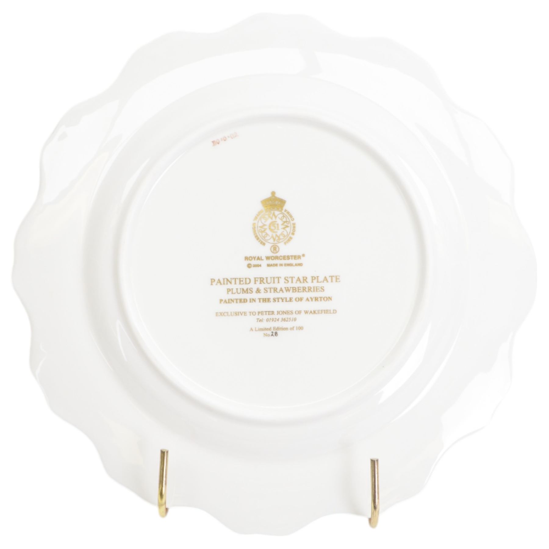 Late 20th century Royal Worcester star plate, of circular form with shaped with gilt shaped rim, hand painted by E Clark with still life of fruit upon mossy ground, signed E Clarke, with marks beneath including limited edition no 28/100, with makers fitted card box, D23cm
