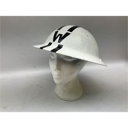 WW2 Home Front 'Police' black painted steel helmet with original liner and webbing chin strap, impressed R.O. Co. 1/1939; and re-painted shell only for WW2 Wardens steel helmet impressed AMC II 1941 C676 (2)