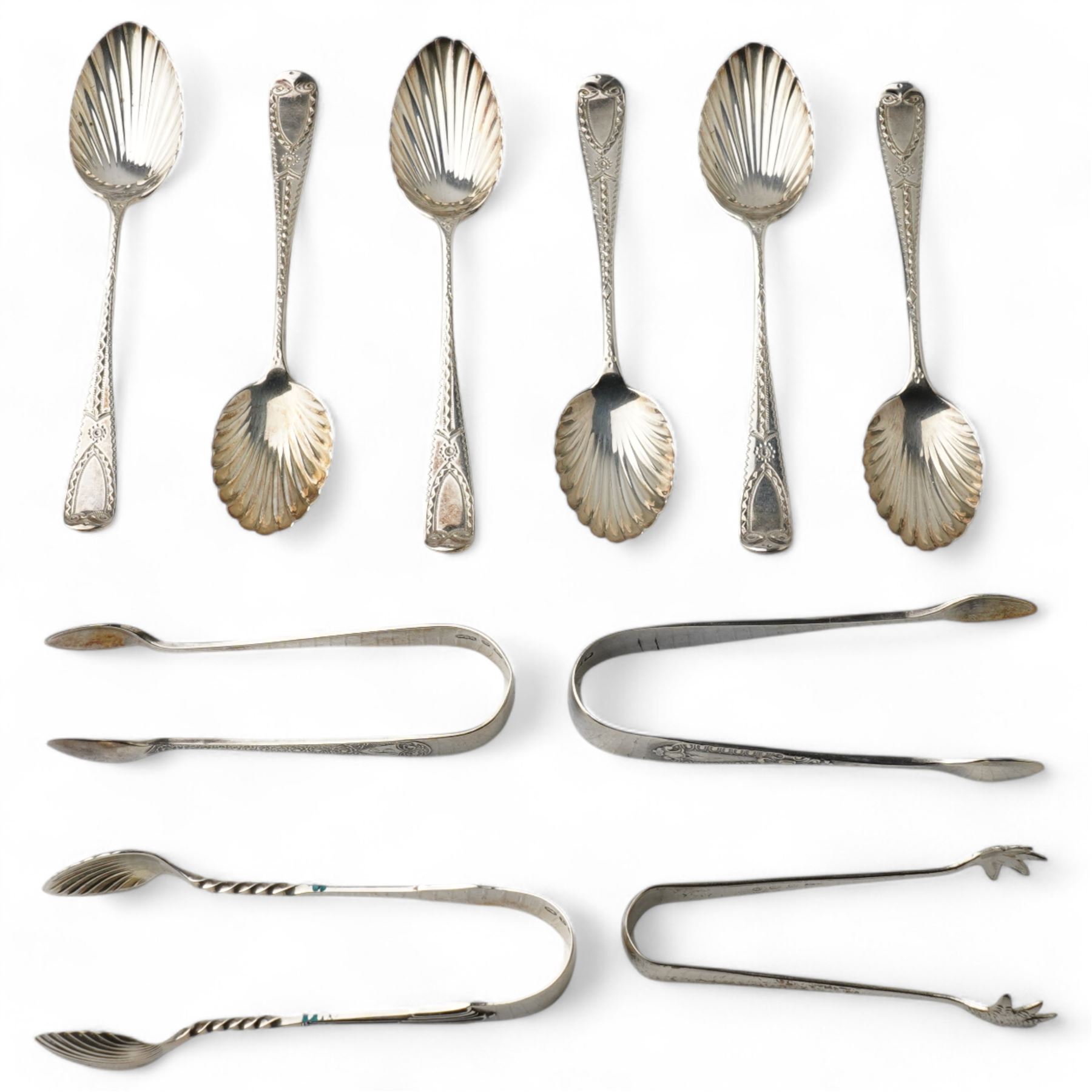 Set of six Victorian silver coffee spoons with fluted bowls and engraved stems London 1891 Maker Josiah Williams & Co and four pairs of silver sugar tongs, various dates