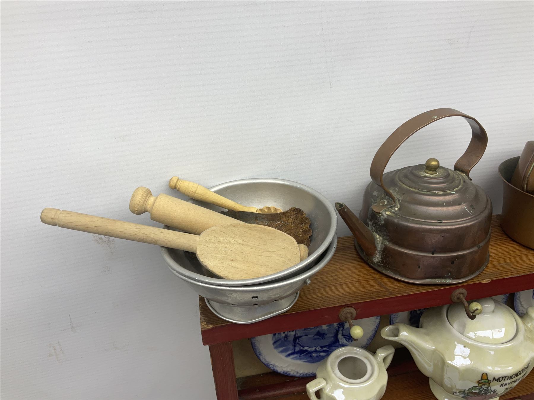 Miniature pitch pine Welsh dresser with open plate rack over two cupboard doors, displayed with Ridgways Humphrey's Clock pattern and other doll's blue/white tea ware, copper kettles and pan etc W41cm H72cm