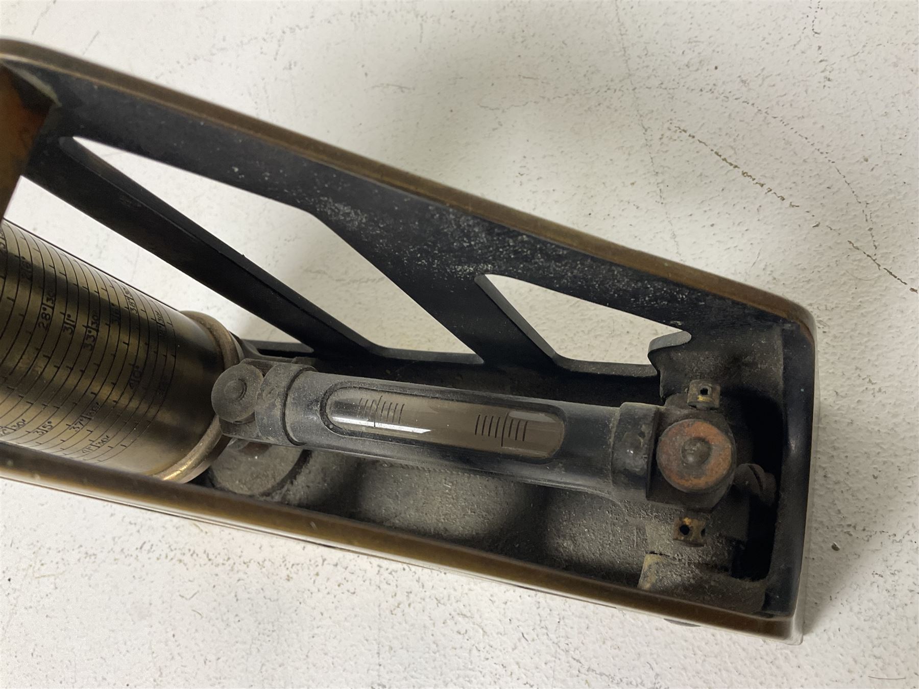 Cambridge Scientific Instruments Co clinometer, flintlock tinder lighter, and a Anders Mattson Mora patent bobbin winder (3)