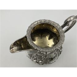 Victorian silver three piece tea service, comprising teapot, twin handled open sucrier, and milk jug, each of bellied form with acanthus capped scroll handles, the sides embossed with alternating scroll edged vacant panels and panels containing a pair of birds, upon four palmette feet, the teapot with ivory insulators to handle, and bird finial to the hinged domed cover, hallmarked William Hunter & Son, London 1861, teapot H19cm, including handles sucrier H13.5cm, including handle milk jug H12cm

This item has been registered for sale under Section 10 of the APHA Ivory Act