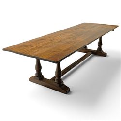 Large 17th century design oak 10ft refectory dining table, the rectangular top raised on twin double-vasiform pedestal end supports on sledge feet, united by chamfered stretcher