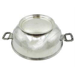 Mid 20th century German silver footed bowl, the body of plain circular form with twin articulated cast handles, marked with crown and crescent mark, and stamped 925 beneath, also bearing import marks for London Assay Office, London 1945, H10cm not including handles D25cm, approximate weight 44.62 ozt (1388 grams)