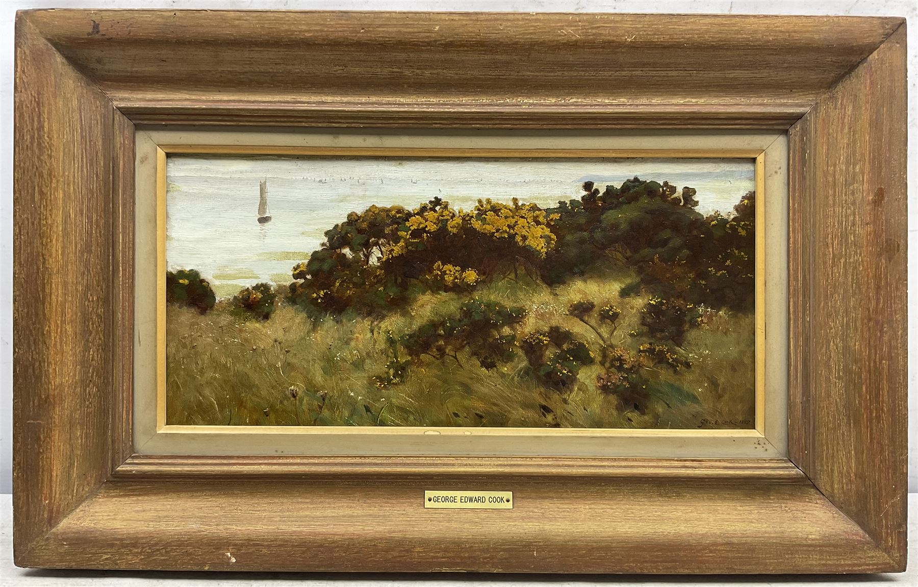 George Edward Cook (British 1844-1914): 'When the Gorse is out of Bloom, Kissing is out of Fashion - Runswick', oil on canvas signed and dated 1885, titled on the stretcher verso 20cm x 43cm