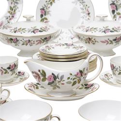 Wedgwood Hathaway Rose pattern tea and dinner wares, comprising two covered tureens, two oval serving dishes, eight dinner plates, eight dessert plates,  six side plates, eight soup bowls and stands, four teacups and saucers, and a sauce boat and stand