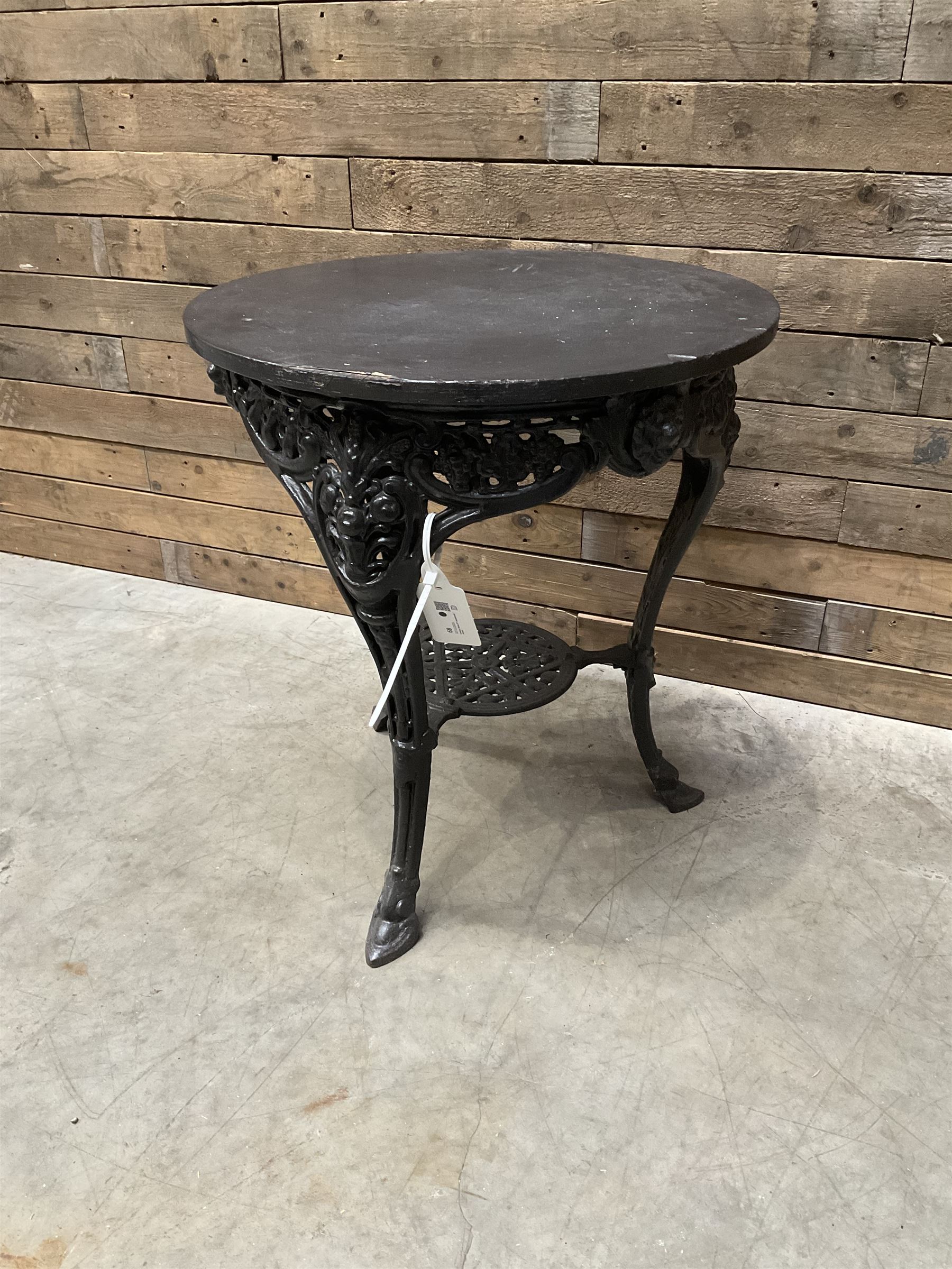 Cast iron Britannia circular pub table, and two pedestal cast iron bases (3)