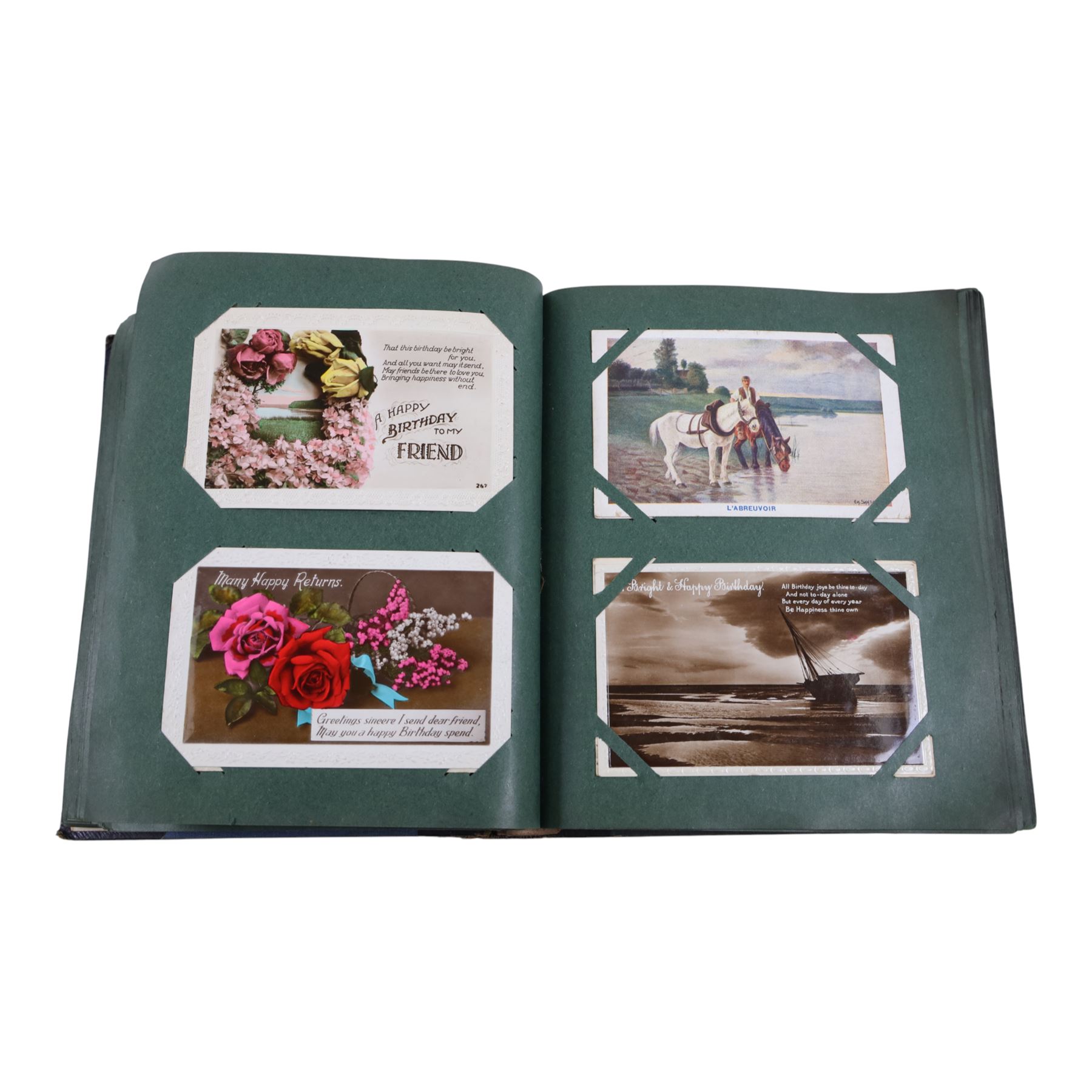 Collection of early 20th century postcards and greetings cards, including WWI embroidered silk Christmas card, black and white family photographs, 1920s birthday cards, black and white and colour postcards of Margate, Ramsgate, Blackpool etc, housed in three postcard albums