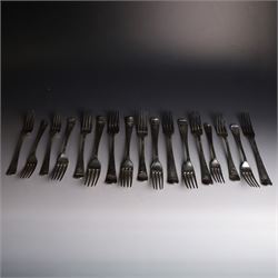 Seventeen Georgian and later silver Hanoverian pattern table and dessert forks, most with engraved initials to terminal and crests verso, including pair of table forks hallmarked William Sumner & Richard Crossley, London 1778