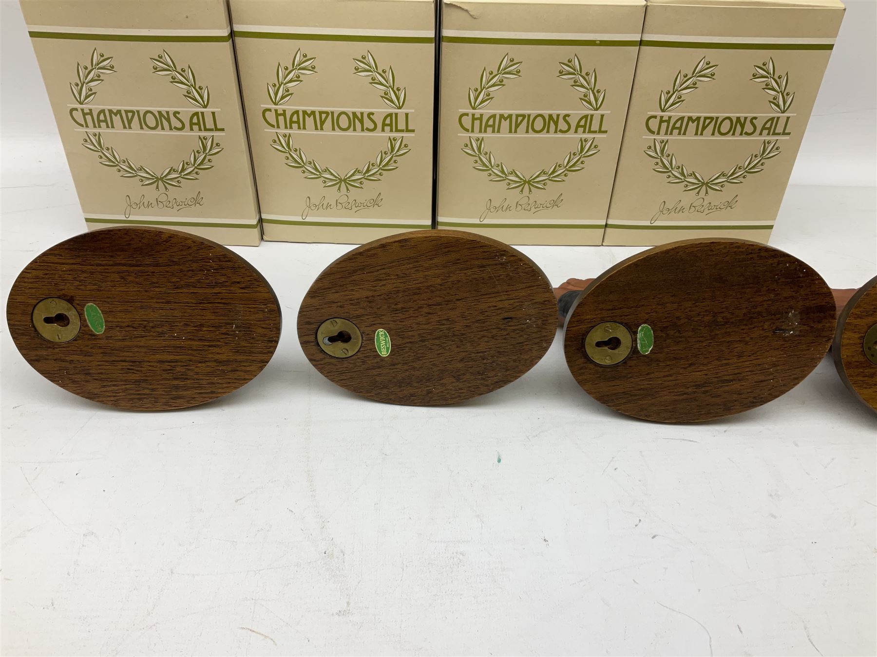 Beswick set of horse head wall plaques 'Champions all', comprising Arkle no.2700, The Minstrel no.2701, Red Rum no.2702, Troy no.2699, all with original boxes