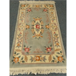  Chinese green ground rug, central medallion, repeating border, 156cm x 92cm  