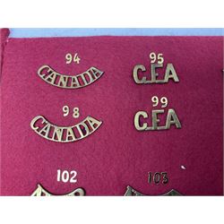 Forty glengarry and cap badges and shoulder titles including Gordon Highlanders, Canada and Canadian Field Artillery, New Zealand Field Artillery and Rifle Regiment, Shropshire Light Infantry, 14th/20th Kings Hussars, 17th Lancers, Northamptonshire Yeomanry, Royal Lincolnshire, Special Air Service, 19th Alexandra P.W.O. Hussars etc; mounted on two boards for display (2)