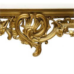 Late 19th to early 20th century giltwood and gesso console table with marble top, shaped white marble top, the base with pierced front decorated with shells and trailing leafy branches with flower heads, on cabriole supports with shell decorated knees, scrolled feet with acanthus leaf terminals 