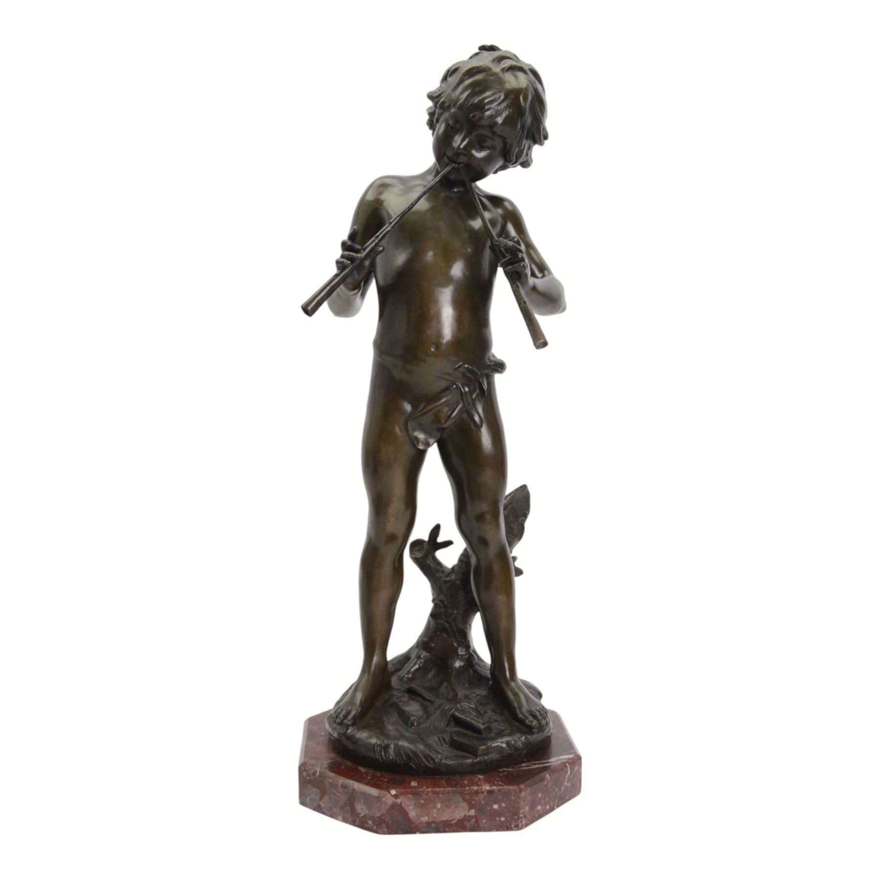 After Auguste Moreau (French 1834-1917): Large Bronze Figure of a Young Boy Playing the Aulos (Double-Reeded Pipes) standing upon a naturalistically modelled base detailed with tree stump and further pipe, signed Aug Moreau, upon octagonal red marble base, H73cm