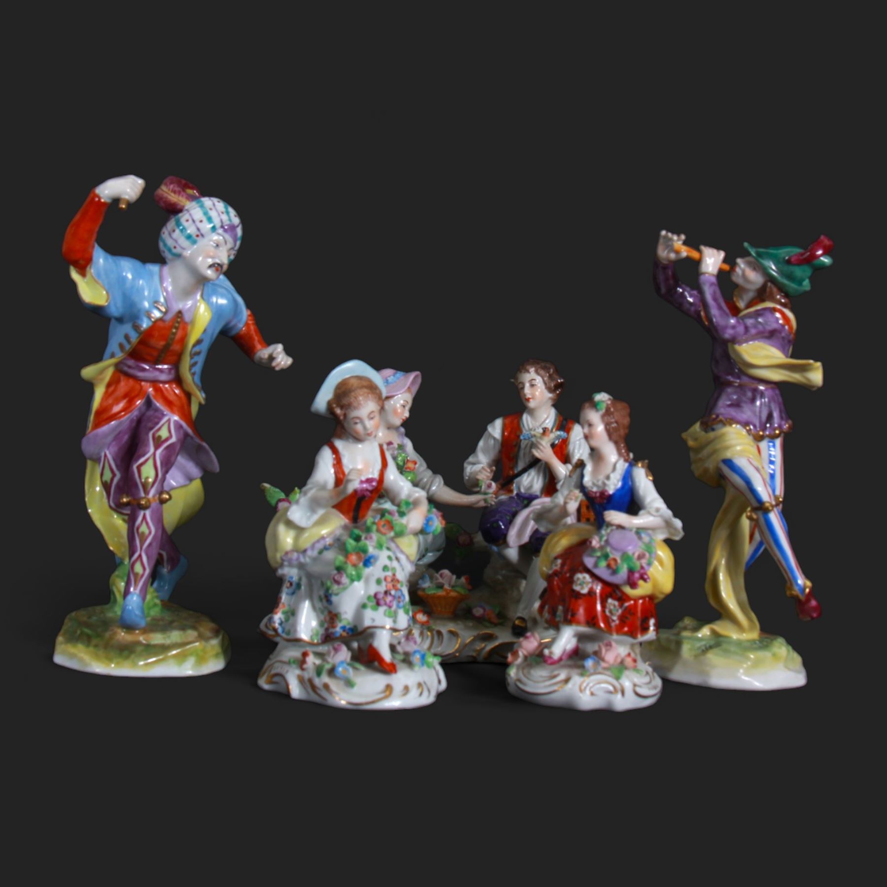 Two Volkstedt figures, comprising Piper and Harlequin, together with three Sitzendorf figures, largest H20cm 