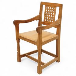 Mouseman - set of six oak dining chairs (5 + 1), pierced and carved lattice back over leather upholstered seat, on octagonal front supports united by stretchers, carved with mouse signature, by the workshop of Robert Thompson, Kilburn