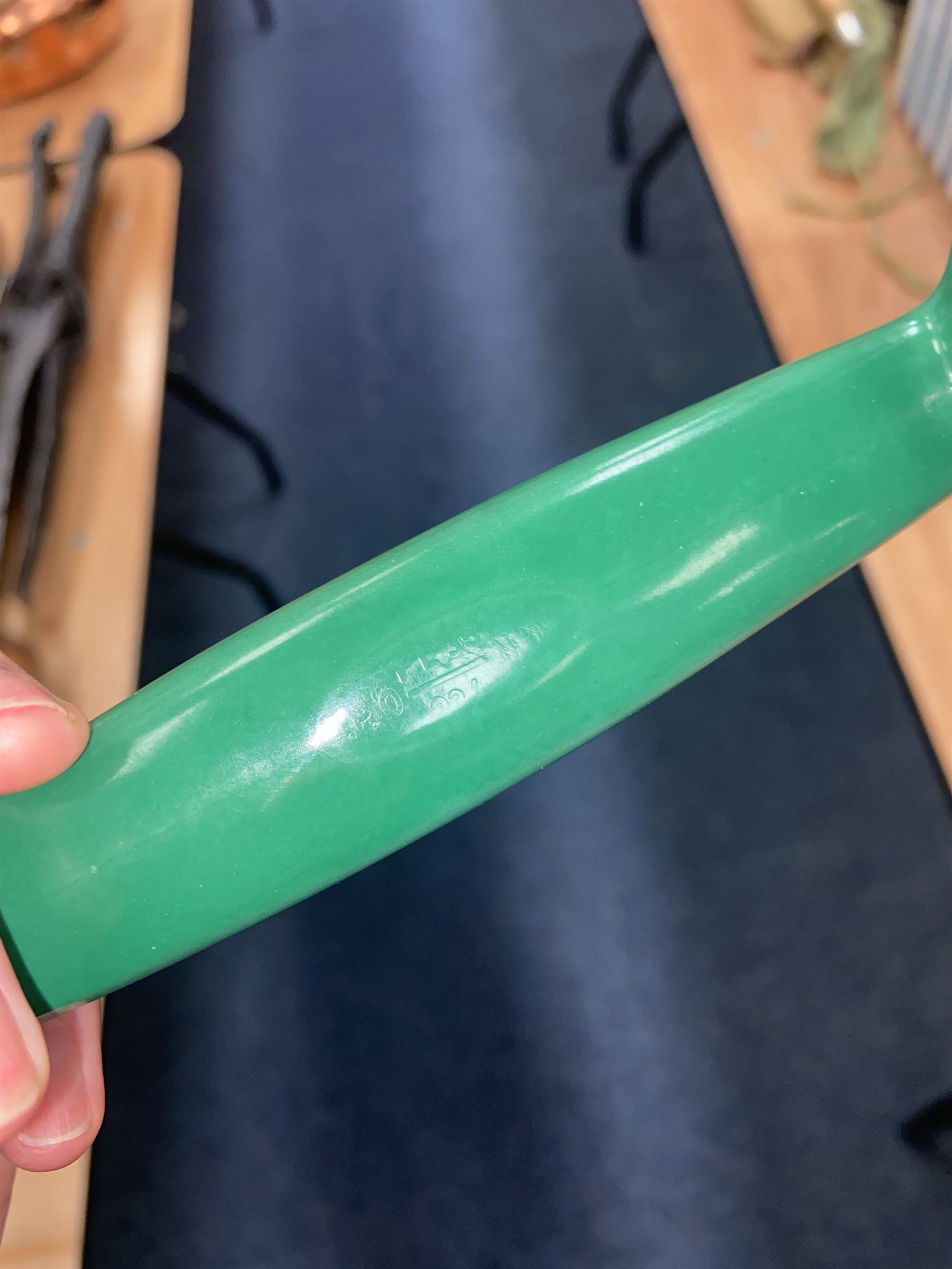 Jade green Bakelite telephone, of pyramid form with alphabet dial, brown braided handset cord and a base draw