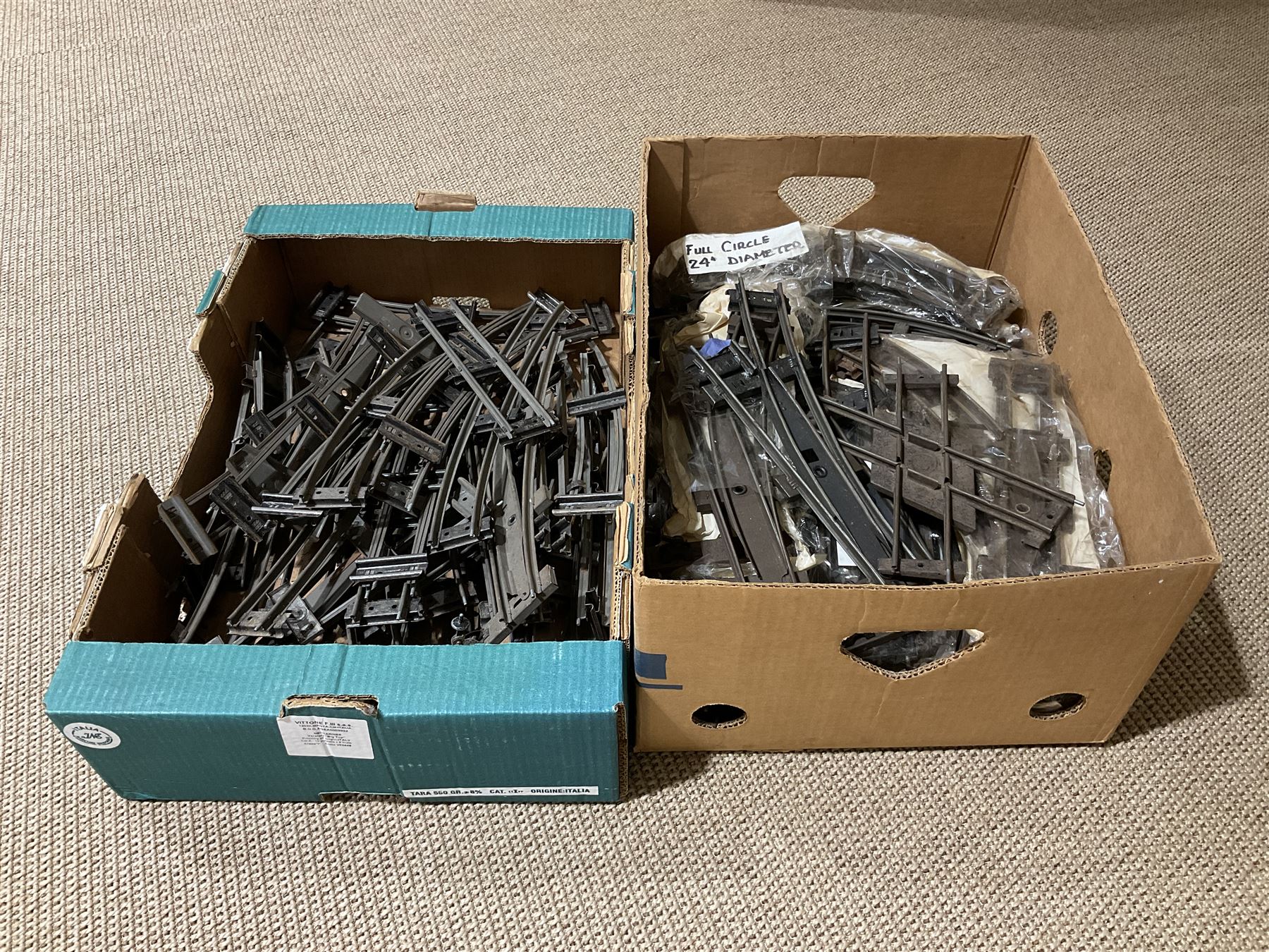 '0' gauge - large quantity of two-rail track with fixing clips including curves, straights, points, cross-overs etc; and boxed Meccano A3 Power Control Units; in four boxes
