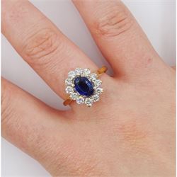 18ct gold oval sapphire and round brilliant cut diamond cluster ring, Birmingham 1994, sapphire approx 1.00 carat, total diamond weight approx 0.70 carat