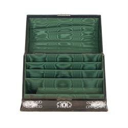 Edwardian silver mounted stationery box and silver mounted blotter, the box of rectangular form with curved front with applied repousse silver panels of putti within a scrolling foliate edge, the hinged cover opening to reveal an emerald green silk lined interior, the blotter with conforming silver mounted panels, each hallmarked William Comyns & Sons, London 1901, box H20cm W31cm D14cm, blotter H32cm W26.5cm