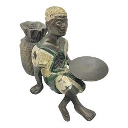 Bronze figure of a seated man resting on a sack