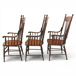 Set of three 19th century ash and elm spindle back Windsor armchairs, arched top rails above fan-shaped spindle backs, curved arms with turned supports, shaped saddle seats, on turned legs joined by H-stretchers