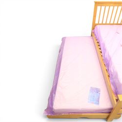 Contemporary light oak trundle bed, slatted headboard and footboard,  incorporating pull-out trundle bed on castors, complete with two memory foam mattresses