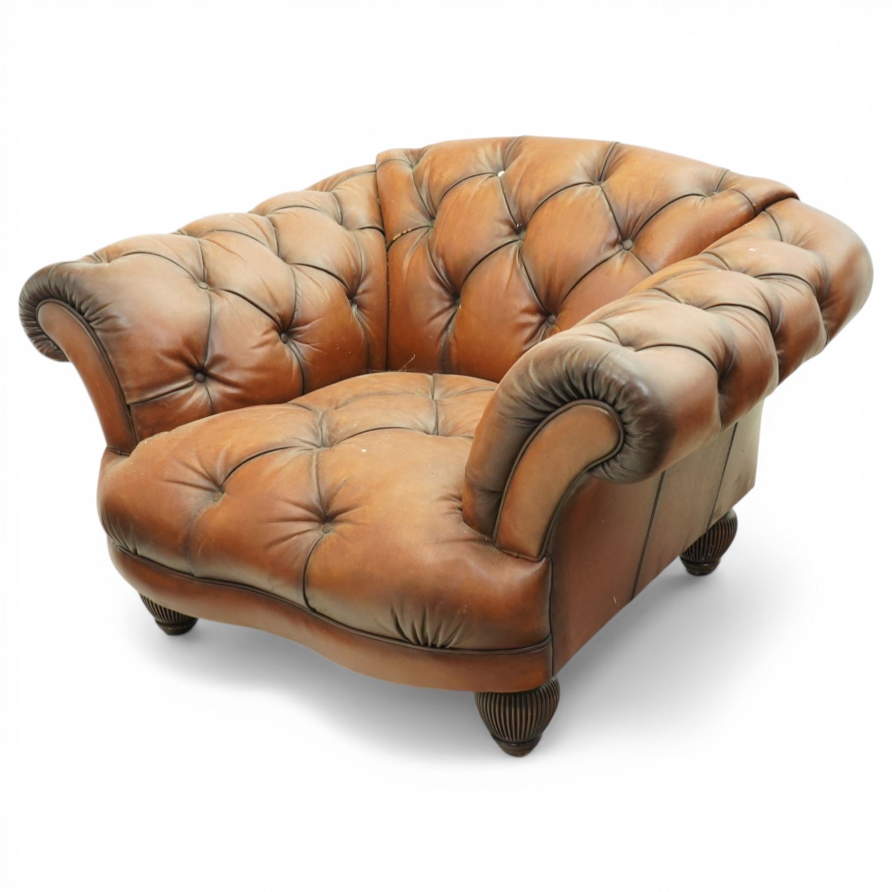 Tetrad England - large armchair upholstered in buttoned leather, with stool