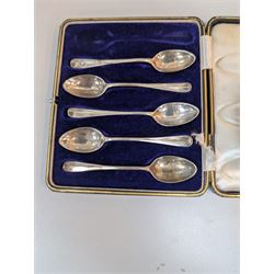 Scandinavian silver bowl, with embossed decoration upon three pad feet, stamped 830s, together with five cased silver coffee spoons, hallmarked, bowl H5cm