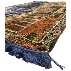 Indigo ground family prayer rug, depicting Masjid al-Haram in Mecca within floral design borders 