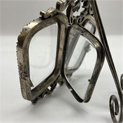 Early 19th century silver plated double photograph frame, each rounded rectangular aperture surrounded by a paste border, with ornate scroll feet and mantling also set with clear paste stones, with easel style support verso, H12cm