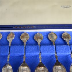 Set of twelve modern silver teaspoons 'The Twelve Zodiac Spoons', all decorated with symbols of the zodiac, hallmarked John Pinches, London 1971, contained within fitted case