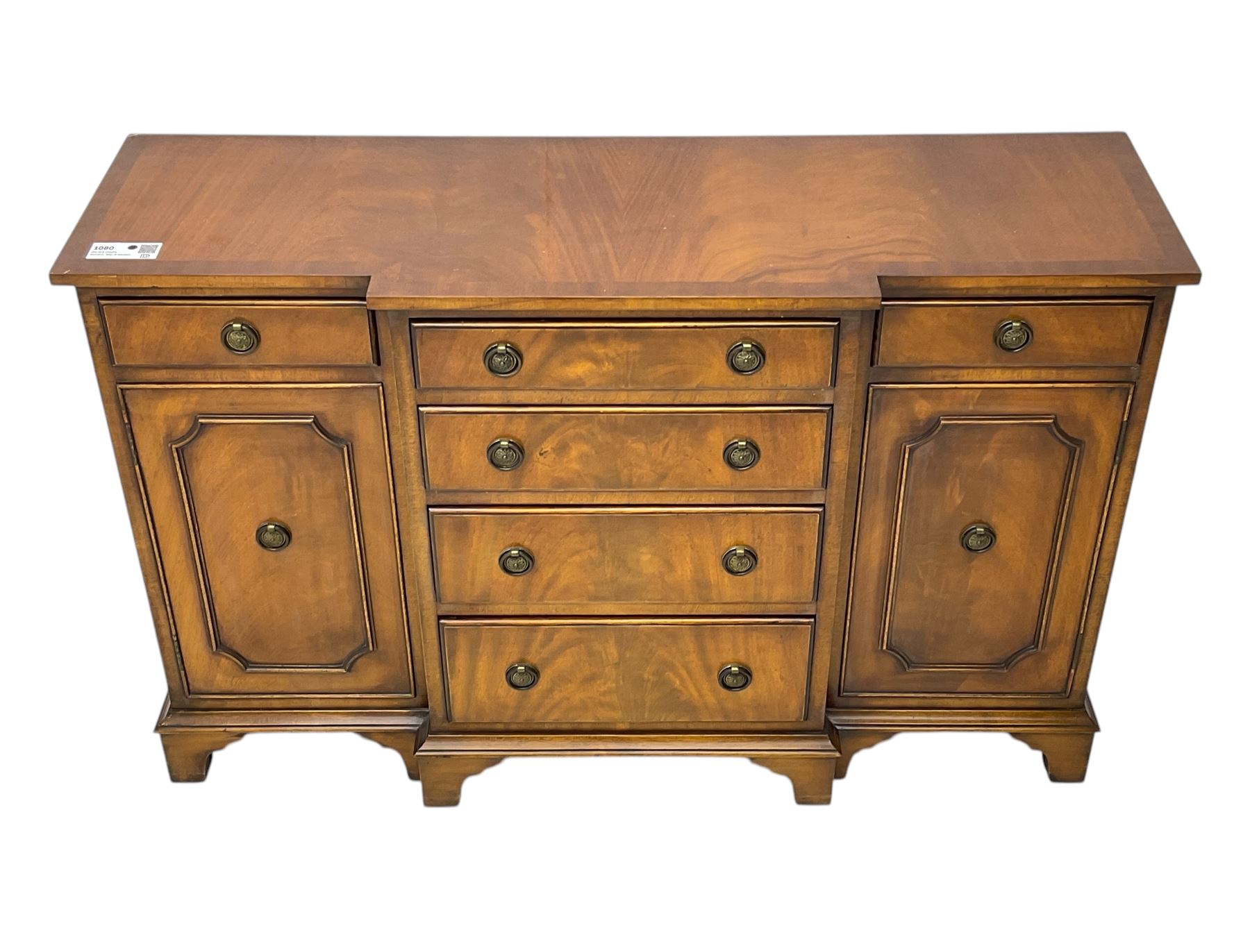 Georgian design mahogany break-front sideboard, fitted with six drawers and two cupboards, on bracket feet 