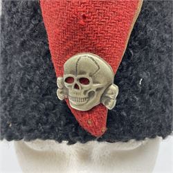 WW2 German small size Balkan style hat with 'SS' metal badges; red cloth top and flash to front with black persianelle type sides; lined in brown card with leather sweatband