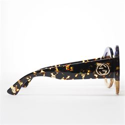 Gucci - pair of oversized round sunglasses, with gradient tinted lenses in a tortoiseshell-effect frame with blue and gold glitter inlay, the temples with interlocking gold-tone GG logo and bee motif, unused with original cloth and hard cases