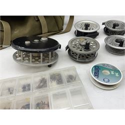 Fishing tackle, including 'The Gnat' fly reel, Alvey 4 1/2 inch reel, Paramount 4 1/2 inch reel, other fishing reels, various fishing flies and other similar items in a carry bag 