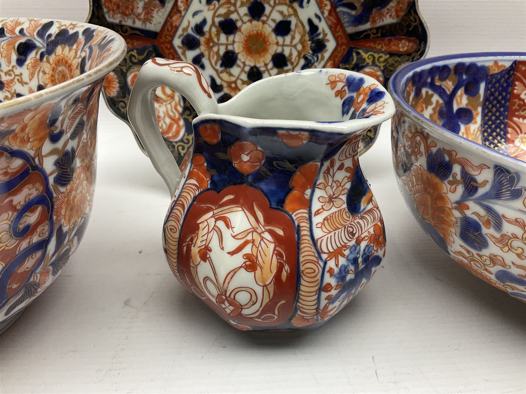 Two Japanese Imari bowls, together with Imari dish with scalloped edge and jug, largest bowl, H12cm