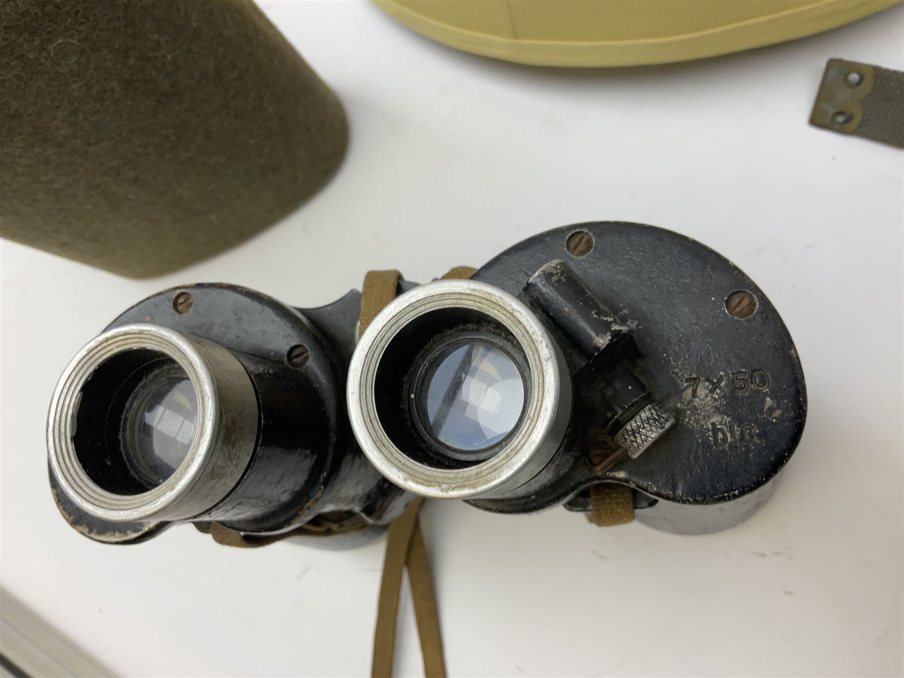 Early 20th century British army peaked cap with Scots Guards brass badge; another later with Scots Guards Staybrite badge; modern pith helmet; British army water bottle with later webbing cover; pair of Carl Zeiss blc 7 x 50 binoculars; and Dunn & Co bowler hat